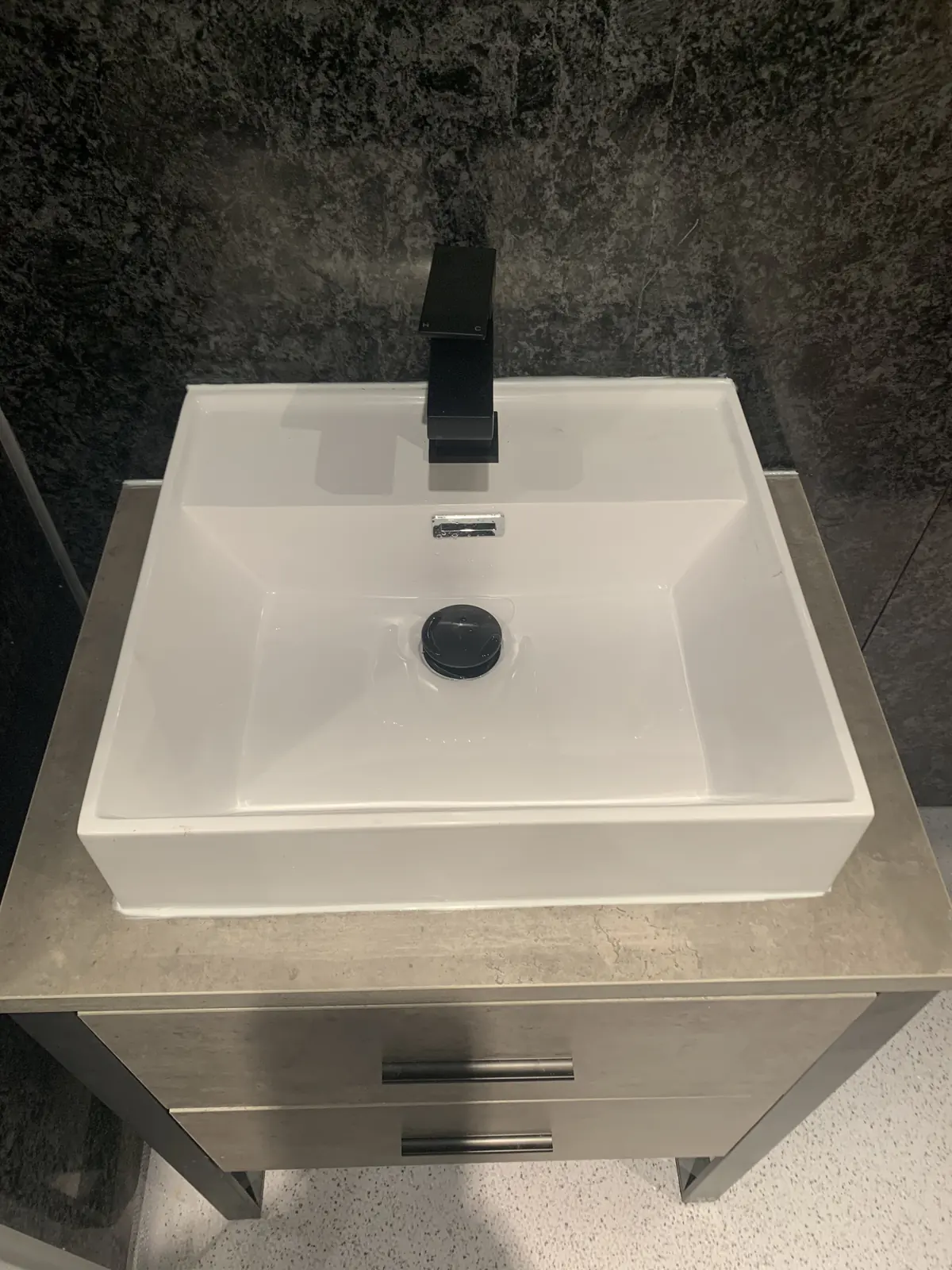 Square basin and black tap fitted by RRG Plumbing