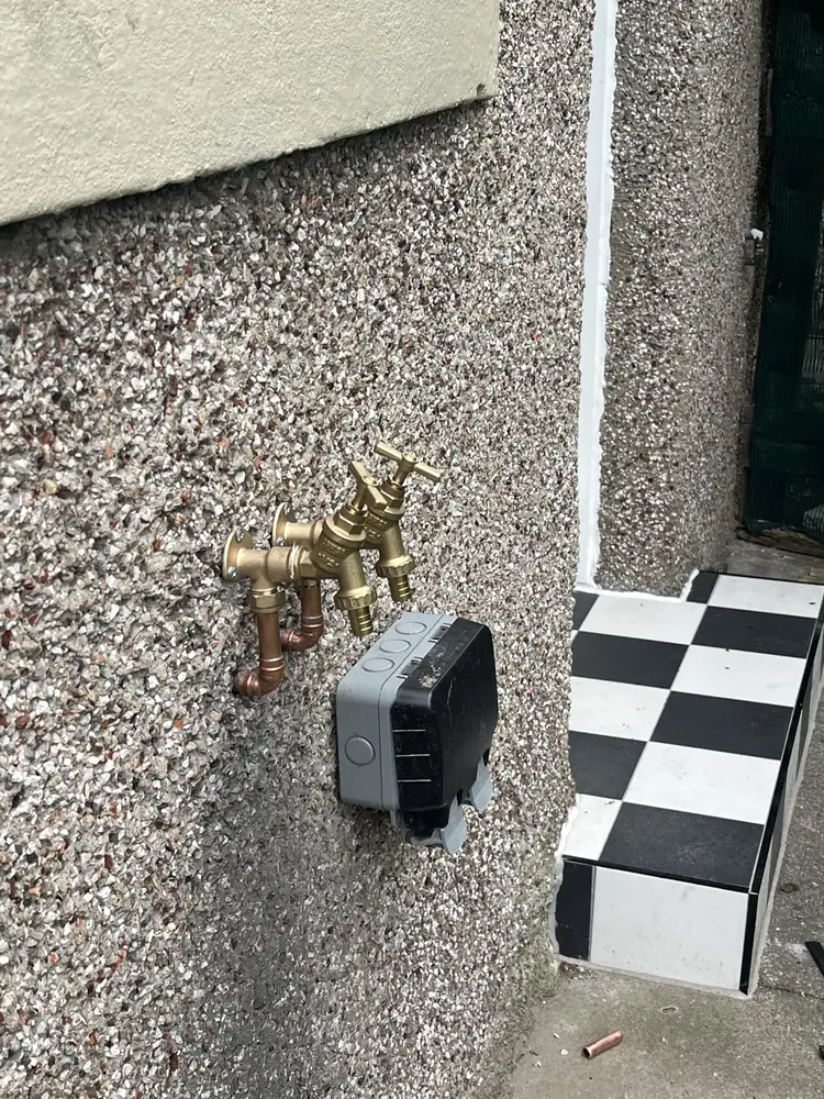 Twin brass outside taps installed by RRG Plumbing