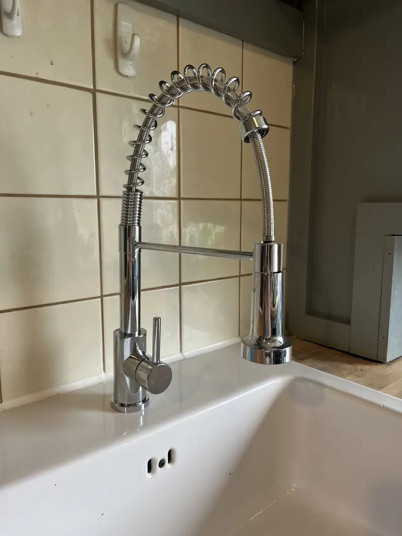 Chrome pull-out kitchen tap installed by RRG Plumbing