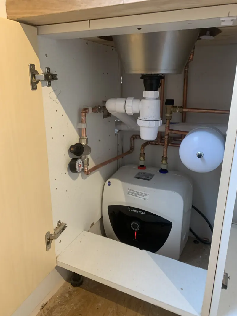 Under-sink pipework, trap and valves repaired by RRG Plumbing
